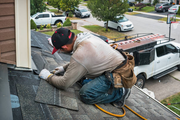 Professional Roofing technician working in Bellingham, MA